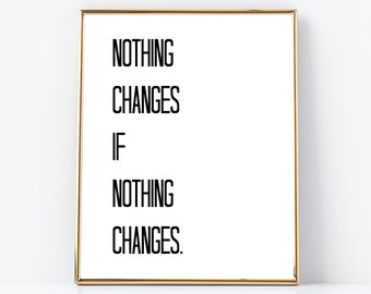 May include: A gold framed print with the text "NOTHING CHANGES IF NOTHING CHANGES." on a white background.