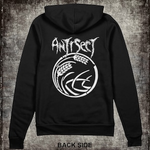 May include: Black hooded sweatshirt with a white graphic of a wheat stalk design and the word "Antisect" in a stylized font.