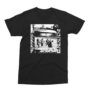May include: Black and white graphic t-shirt featuring a band called "Civil Disobedience" with the text "in a few hours of madness" and "few words of peace".