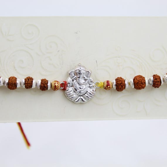 Silver Ganesh Rakhi with Rudraksha Beads, Sacred Hindu Festival Thread