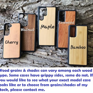 a collection of wooden phone cases in various types of wood, including cherry, maple, rosewood, and bamboo, arranged on a textured surface.