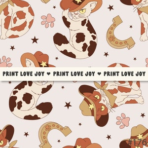 May include: A repeating pattern featuring cartoon cats wearing cowboy hats, horseshoes, paw prints, and stars in shades of brown, tan, and white. The text "PRINT LOVE JOY" is displayed across the image.
