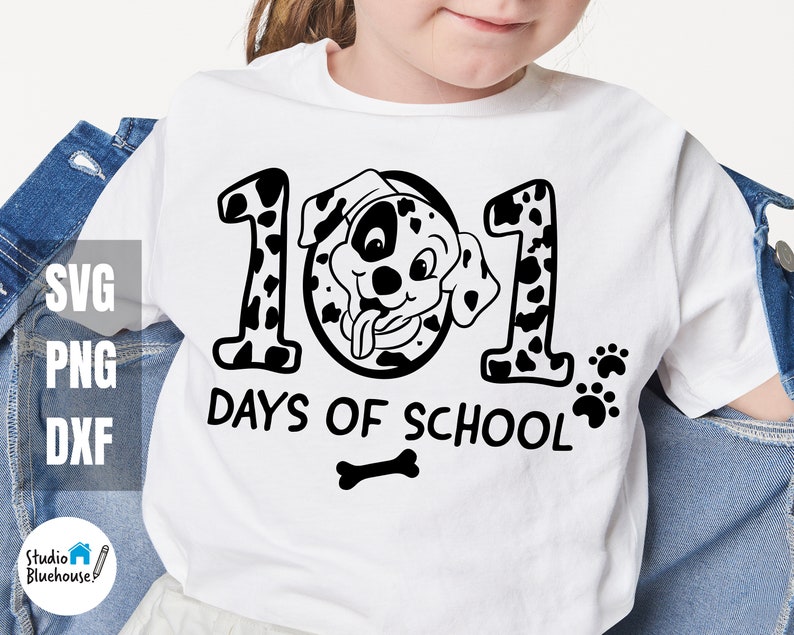May include: White t-shirt featuring a black and white dalmatian dog design. The design includes the numbers "101" and the text "Days of School".