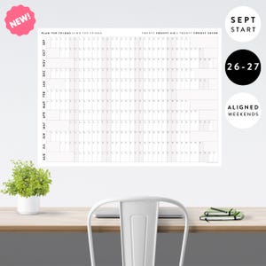 May include: A large white wall calendar spanning September 2026 through August 2027, titled PLAN THE THINGS // DO THE THINGS. It features a grid layout with months listed vertically, numbered days, and shaded columns for aligned weekends.
