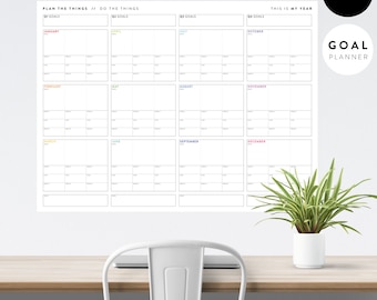 May include: A white undated goal planner with a monthly calendar layout. The planner has a black title bar with the text "This is my year" and "Undated Goal Planner".