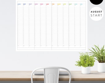 May include: An undated calendar planner with a white background and black grid lines. The months are labeled in color: August, September, October, November, December, January, February, March, April, May, June, and July. The text "Plan the things // Do the things" is at the top of the calendar. The text "This is my year" is at the top right corner of the calendar. The text "Undated" is at the top right corner of the calendar. The text "August Start" is at the bottom right corner of the calendar.