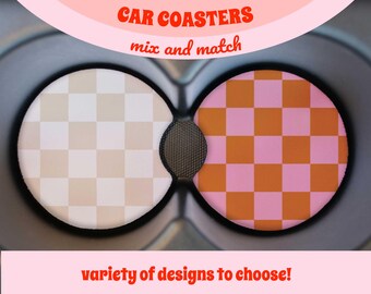 May include: Two round car coasters with a checkered pattern. The coaster on the left is beige and white, and the coaster on the right is orange and pink. The text "CAR COASTERS mix and match" is above the coasters, and the text "variety of designs to choose!" is below the coasters.