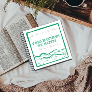 May include: A white journal with a green and white wave design. The journal is titled "Foundations of Faith Worship Journal" and has the words "The Wind & The Waves" in a smaller font above the title.