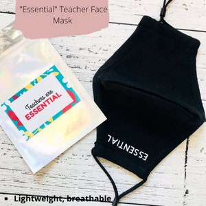 May include: Black face mask with the text "ESSENTIAL" printed in white. The mask is made of 3-ply cotton and has adjustable ear loops. A small bag with the text "Teachers are ESSENTIAL" is also shown.
