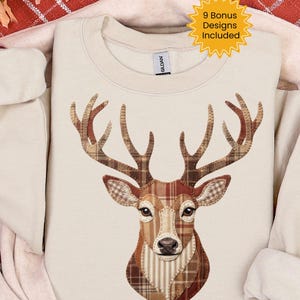 May include: Cream-colored sweatshirt featuring a deer head design. The deer's head and antlers are composed of various brown plaid and patterned fabrics. The text "9 Bonus Designs Included" is in a yellow starburst.