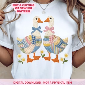 May include: White t-shirt featuring a whimsical design of two geese with patchwork wings, wearing bows. The geese stand among small daisy flowers. Text on the shirt reads "NOT A CUTTING OR SEWING PATTERN" and "DIGITAL DOWNLOAD - NOT A PHYSICAL ITEM."