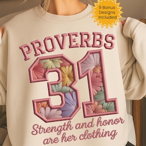 Könnte beinhalten: Cremefarbenes Sweatshirt mit gesticktem Text und floralem Design. Das Wort "PROVERBS" ist über der Zahl "31" angeordnet, die mit bunten Blumen gefüllt ist. Darunter steht der Text "Stärke und Ehre sind ihre Kleidung."