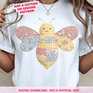 May include: White t-shirt with a patchwork bee design. The bee has yellow gingham and floral patterned wings and body. Text on the shirt reads "NOT A CUTTING OR SEWING PATTERN" and "DIGITAL DOWNLOAD - NOT A PHYSICAL ITEM".