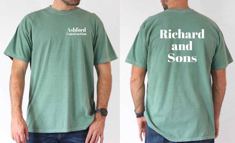 May include: A green t-shirt with the text "Ashford Construction" on the front and "Richard and Sons" on the back.