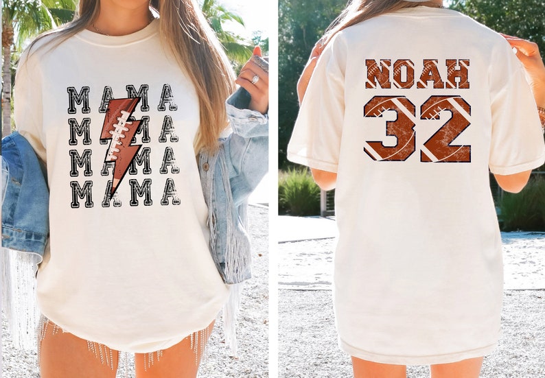 May include: Two white t-shirts with a football theme. One shirt says "MAMA" with a lightning bolt and football graphic. The other shirt says "NOAH 32" with a football graphic.