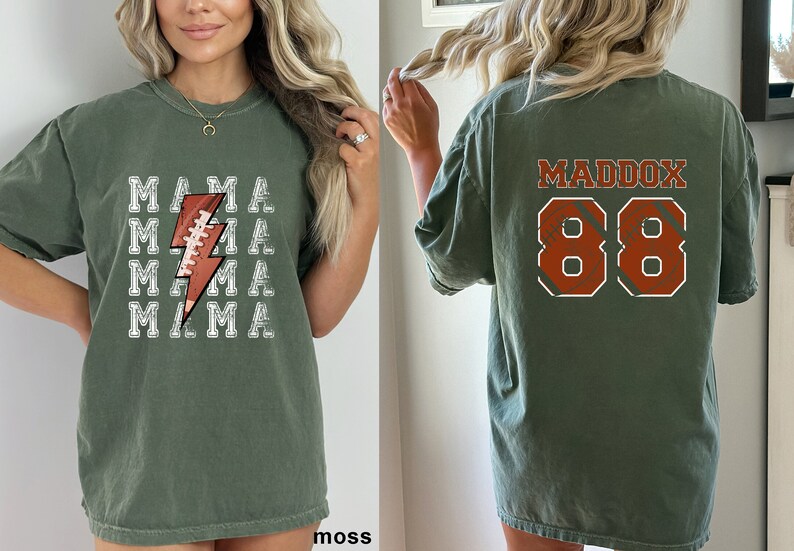 May include: A green t-shirt with a white lightning bolt design featuring a football. The back of the shirt has the name Maddox and the number 88 in orange.