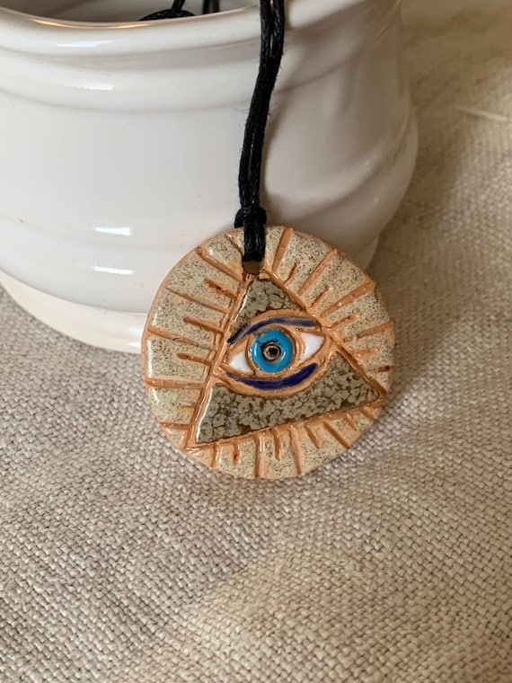 Magic eye necklace sale