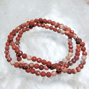 Ball bracelet faceted red jasper (4.5-5 mm)