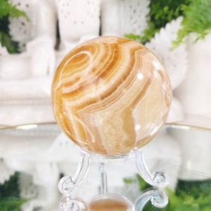 Orange calcite ball with stand