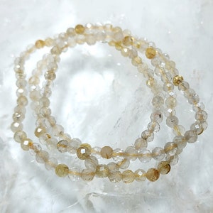 Ball Bracelet Rock Crystal Rutile Gold Faceted (3.5-4.5 mm)