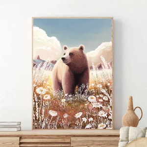 May include: A framed art print featuring a brown bear standing in a field of white wildflowers. The bear is the focal point, set against a backdrop of a blue sky with fluffy white clouds. The artwork has a warm, natural color palette.