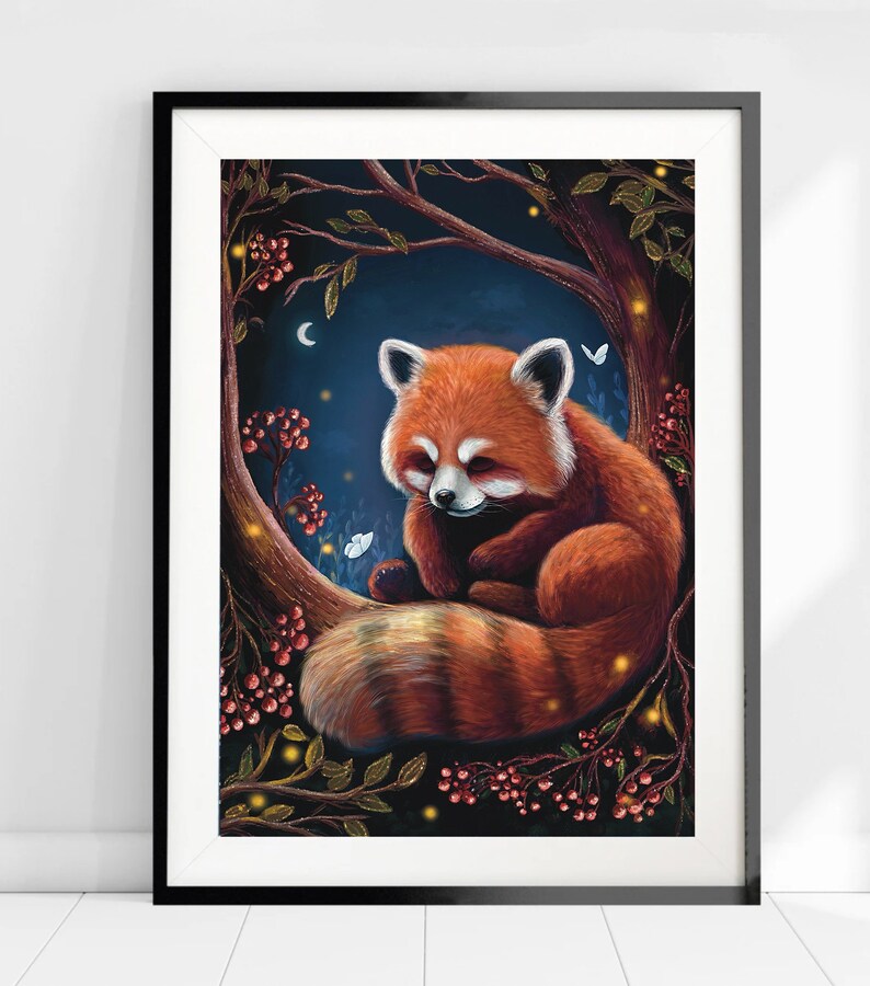 May include: Framed art print featuring a red panda nestled in a tree. The artwork has a dark blue background with a crescent moon and butterflies. The red panda has orange fur with white accents, and the tree has berries and glowing lights.
