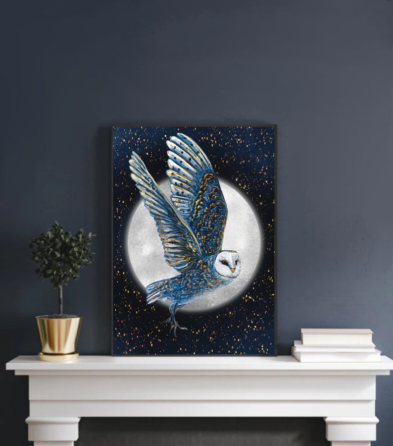 May include: A blue and gold owl with white feathers flies in front of a full moon against a dark blue background with gold glitter stars.