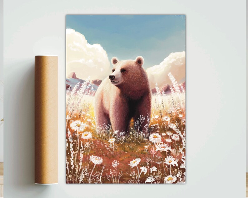 May include: A framed art print of a brown bear standing in a field of white wildflowers. The bear is facing to the side, with a blue sky and fluffy clouds in the background. A rolled-up poster is on the left.