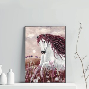 May include: A white horse with a long, flowing mane of pink and white hair stands in a field of pink wildflowers. The horse has a white face with a black nose and black eyes. The horse is looking to the left of the image. The background is a soft pink and white sky.
