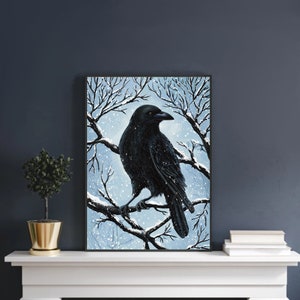 May include: A black crow perched on a snow-covered branch in a wintery forest scene. The crow is facing right and has its wings folded. The background is a light blue with white snow falling.