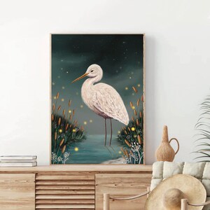 May include: A white egret stands in a body of water with tall green reeds and glowing yellow fireflies in the background. The egret has a long, thin neck and a long, thin beak. The water is a dark blue color and the reeds are a dark green color. The fireflies are a bright yellow color.