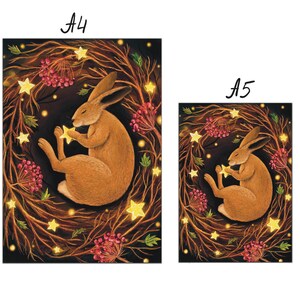 May include: A brown rabbit with long ears is curled up in a nest of branches with glowing yellow stars and red berries. The rabbit is holding a star in its paws. The background is dark.