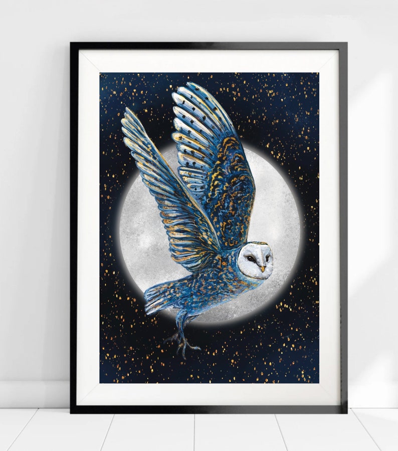 May include: A blue and gold owl with white feathers flies in front of a full moon against a dark blue background with gold glitter.