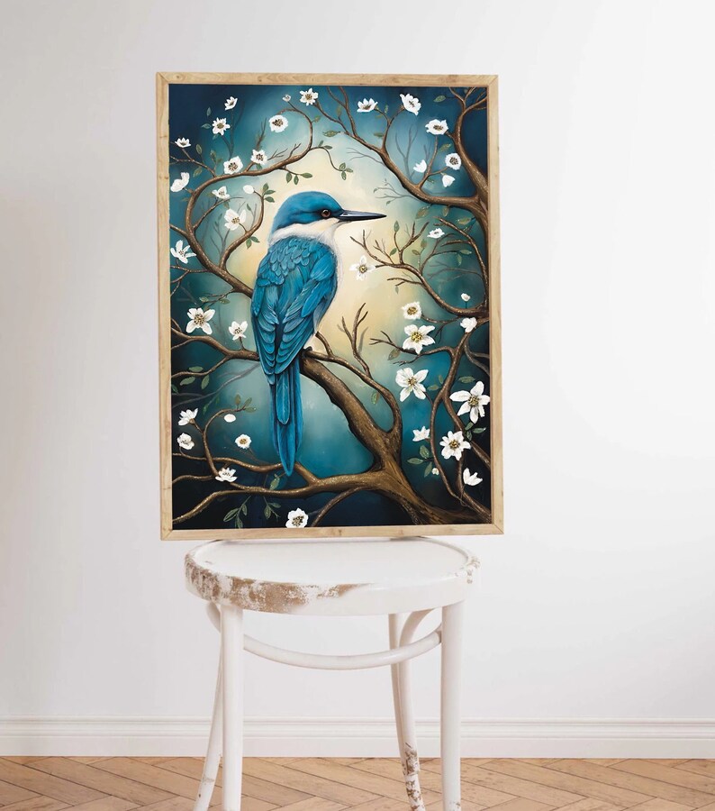 May include: A framed painting of a blue bird perched on a branch with white blossoms. The background is a dark blue with a hint of yellow.