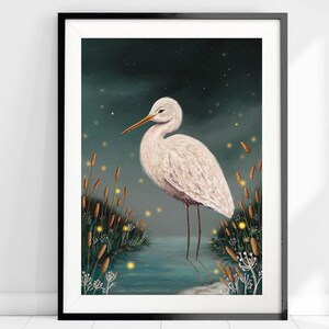 May include: A white egret stands in a body of water with tall reeds and glowing fireflies in the background. The egret has a long neck and long legs. The water is a dark teal color. The background is a dark blue with white stars.