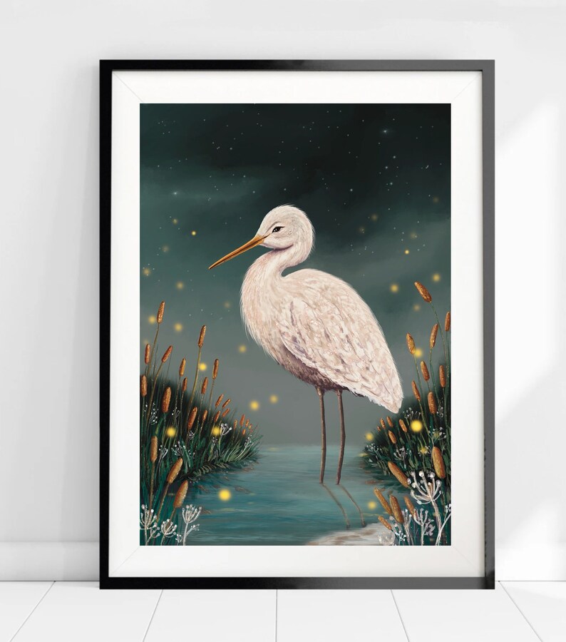 May include: A white egret stands in a body of water with tall reeds and glowing fireflies in the background. The egret has a long neck and long legs. The water is a dark teal color. The background is a dark blue with white stars.