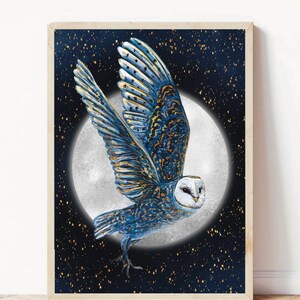 May include: A blue and gold owl with white feathers flies in front of a full moon against a dark blue background with gold glitter.