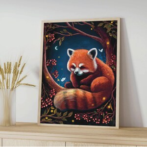 May include: A framed art print featuring a red panda resting on a tree branch. The artwork has a dark blue background with a crescent moon, berries, and glowing lights. The red panda has a fluffy tail and white markings.