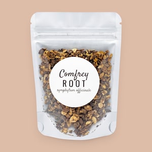 May include: A white stand-up pouch containing dried, chopped brown comfrey root. A circular white label on the front features the text Comfrey ROOT symphytum officinale in black lettering. The pouch has a clear window showing the contents.