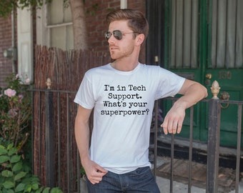 May include: A white t-shirt with black text that reads "I'm in Tech Support. What's your superpower?"