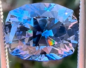 Light blue lab sapphire 6.80 carats 12.11 x 9.59 x 7.89 mm, custom cushion cut. Periwinkle lab sapphire. Precision cut