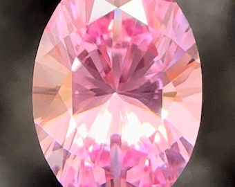 Pink lab sapphire 4.95 carats, 12.61 x 8.81 x 6.29 mm. Brilliant cut oval. Precision cut pink sapphire