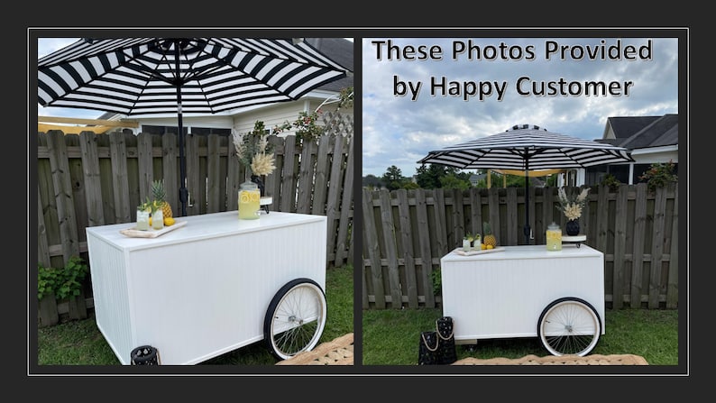 May include: Two white wooden bar carts with black and white striped umbrellas, set up outdoors with lemonade and pineapple garnishes.  "These Photos Provided by Happy Customer" text is visible in the image.