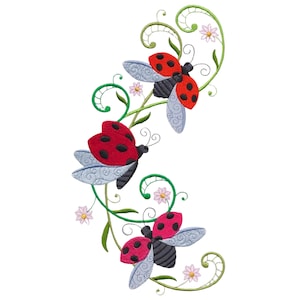 May include: Embroidered design featuring three ladybugs with red and black bodies, black antennae, and patterned gray wings. The ladybugs are positioned along a green, swirling vine with small pink flowers and green leaves. The background is white.