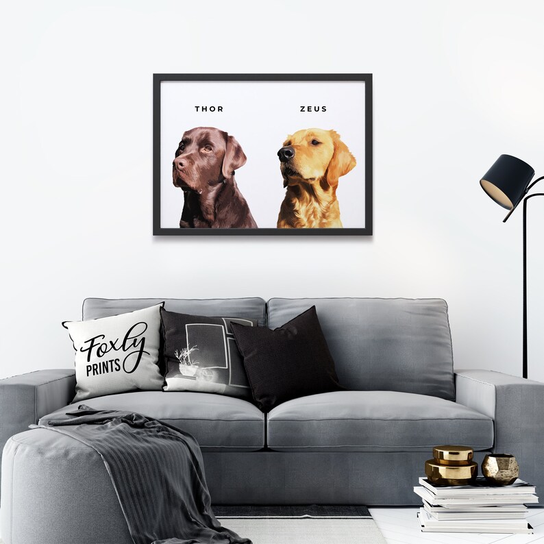 May include: A black framed print with two dogs, one brown and one golden, with the names "Thor" and "Zeus" written above them.
