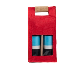 May include: Red burlap wine gift bag with two clear glass bottles with blue and white labels. The bag has a brown burlap handle.