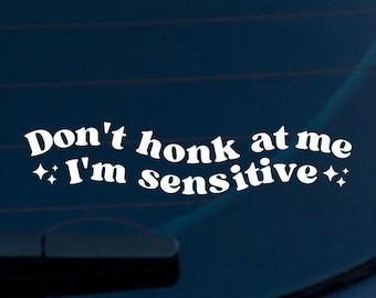 May include: White vinyl sticker with the text "Don't honk at me I'm sensitive" with two small stars on either side of the text.