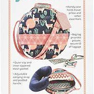 May include: A travel set with a patterned bag and a neck pillow. The bag features a design with llamas, cacti, and geometric shapes in shades of black, pink, and white. The text "Jet Set 2.0" is at the top.