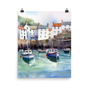 May include: A watercolor painting of a harbor scene with white houses lining the shore and several small boats in the water. The water is a light blue-green color and the sky is a light blue.