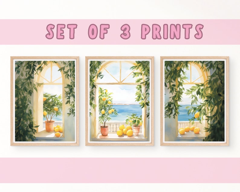 May include: Set of three watercolor prints featuring a window view of a lemon tree and the ocean. The prints are framed in natural wood.